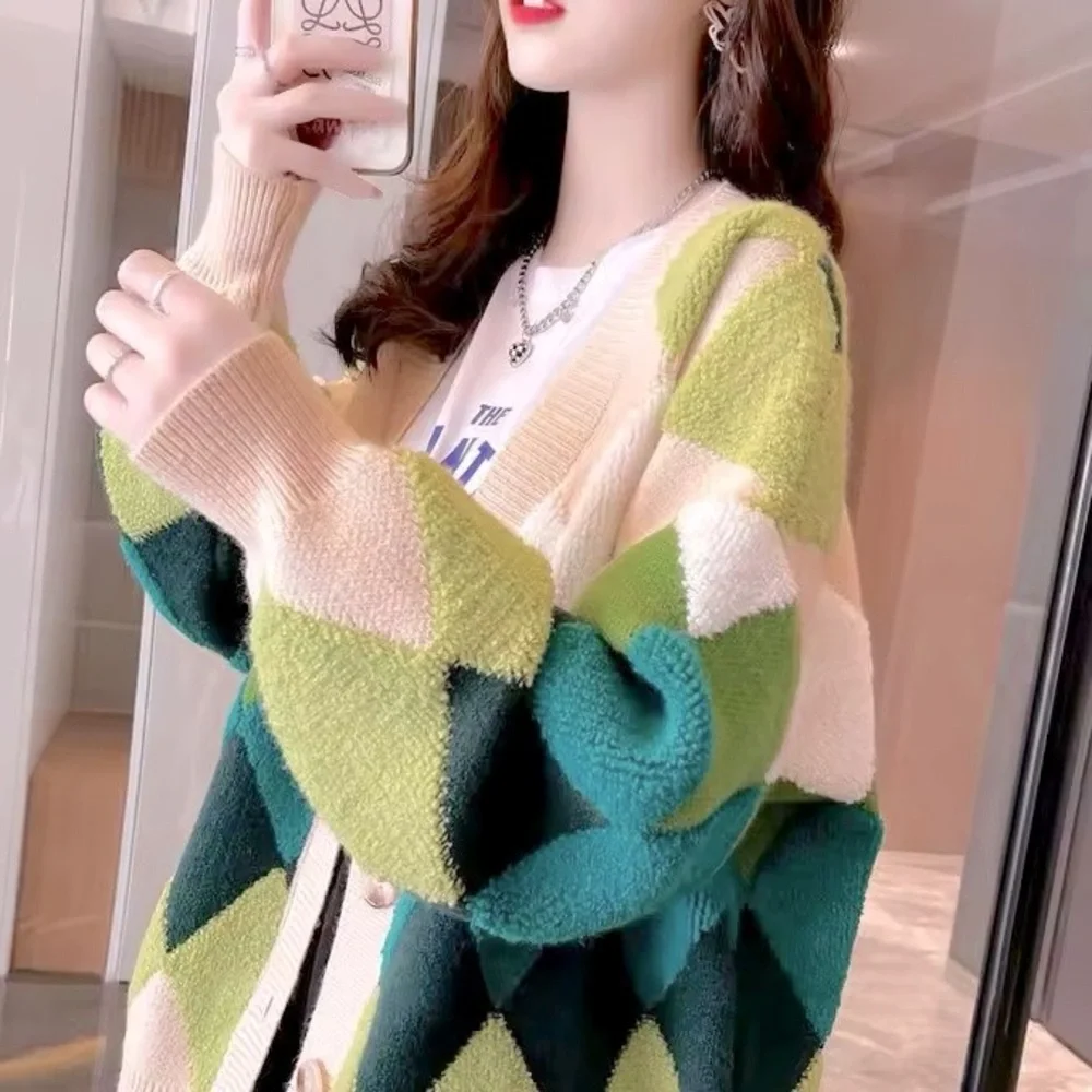 Green and cream harlequin patterned button up sweater
